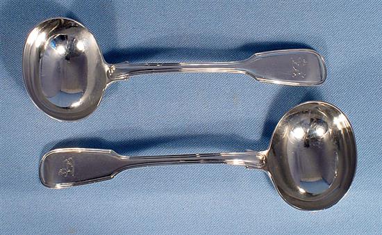 A set of four Victorian silver fiddle pattern sauce ladles, by Elizabeth Eaton, Length: 185mm Combined weight 11.3oz/352grms